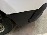 a close up of the front bumper of a white truck