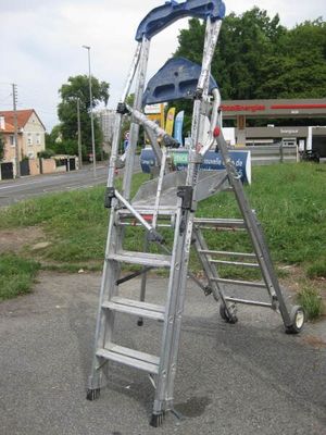 a ladder that is sitting on the side of the road