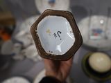 a person holding a plate with a number on it