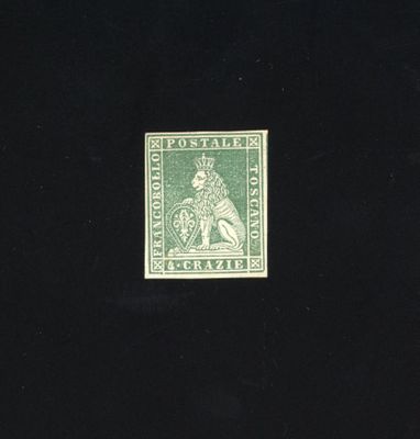 the stamp is green and has a picture of a man on a horse
