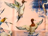 many birds that are flying over the water