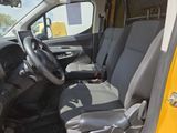 the interior of a van with the door open and the driver ' s seat up