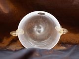 a white bowl sitting on top of a brown cloth