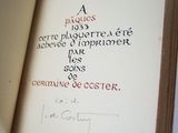 an open book with writing on it sitting on top of a table