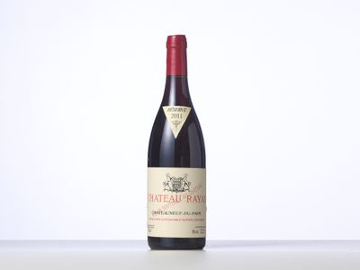 a bottle of red wine sitting on top of a table