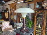 a lamp that is sitting on a table in a room