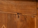 a close up of a wooden cabinet with a clock on it