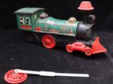 a toy train that is sitting on a black surface