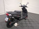a scooter that is parked in a garage