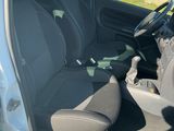 the interior of a car with the door open showing the driver ' s seat