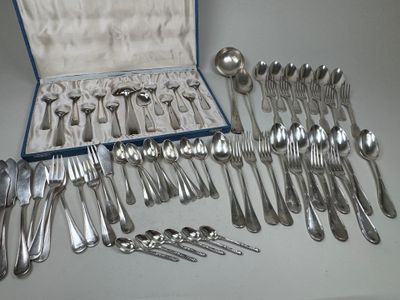 a lot of silver spoons and spoons in a case