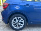 a blue car parked on the side of the road