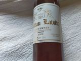 a bottle of wine that is sitting on a towel