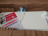 a toilet in a cardboard box with the lid open