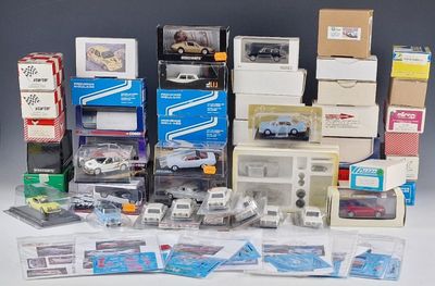 a lot of toy cars and boxes on the table