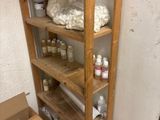 a wooden shelf with a lot of bottles and bottles on it