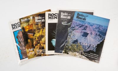 four books of rock and mineral magazines on a white surface