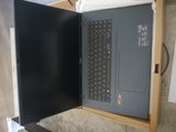 a laptop that is open on a table