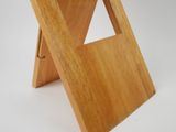 a small wooden table with a triangle design on it