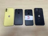 three iphones are sitting next to each other on a table