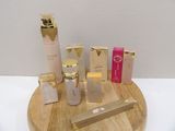 a wooden tray with a lot of beauty products on it