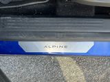 a close up of a car door handle with a sticker on it