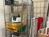 a metal cart with baskets and other items in it