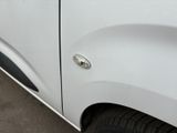 a close up of a white truck with a black door handle