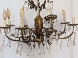 a chandelier that has five lights attached to it