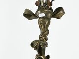 a statue of a giraffe holding a knife and fork