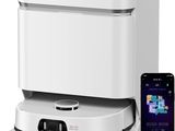 an image of a white and black coffee maker next to a cell phone