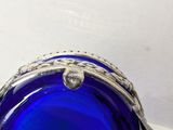 an image of a blue glass bowl sitting on a table