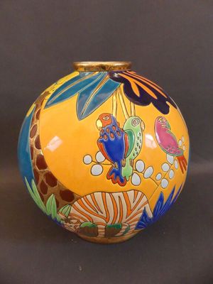 a yellow vase with colorful designs on it on a black background