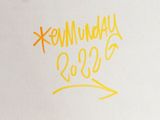 a picture of a white box with yellow writing on it