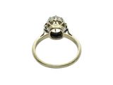 a close up of a ring with a diamond on top of it
