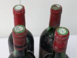 three bottles of wine sitting next to each other on a table