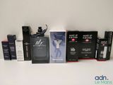 de nombreux parfums et coffrets de toutes sortes sur la table