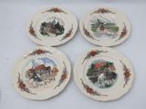 four plates with a picture of a horse drawn carriage on them