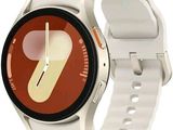 a smart watch with a white band and a red face