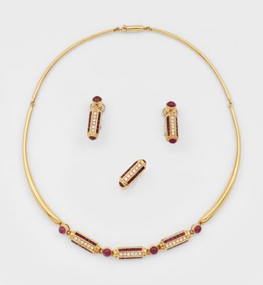 a gold and ruby necklace and earring set