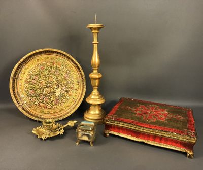 three pieces of gold and red are sitting on a table
