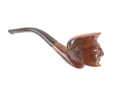 une image représentant une pipe sur laquelle figure le visage d'un homme