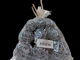 a bag full of balls of yarn on a black background