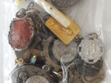 a bag full of coins and a cross on top of it