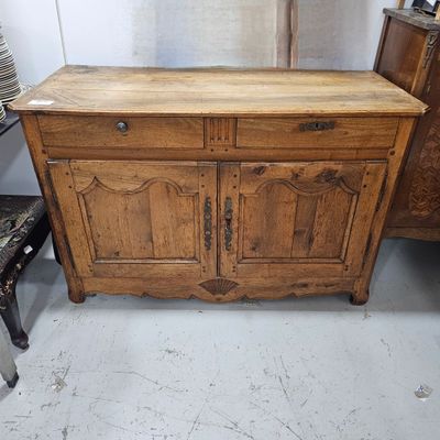 a wooden cabinet with two doors and two drawers