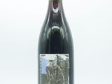 a bottle of wine that is sitting on a table