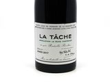 a bottle of wine that is sitting on a table