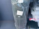many bags of clothing on the shelf in the store