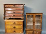 three pieces of furniture including a dresser, cabinet, and chair