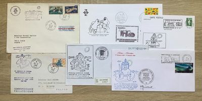 many different stamps and envelopes laid out on a table